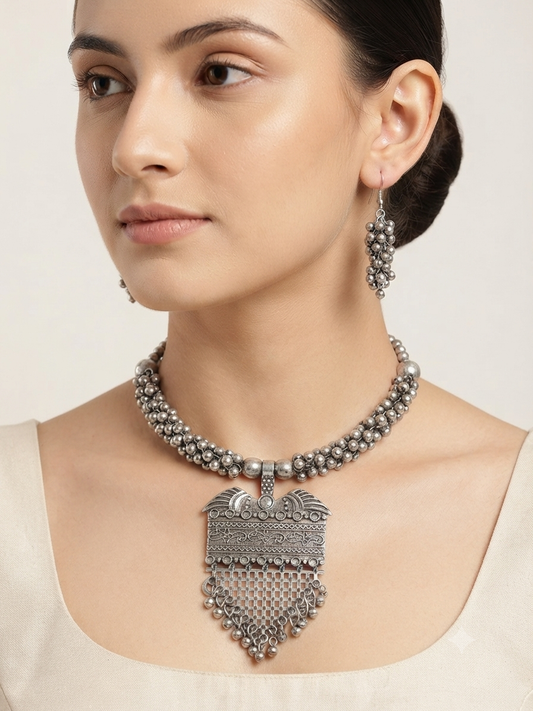 Umakriti Oxidized Silver Tribal Charm Necklace Set